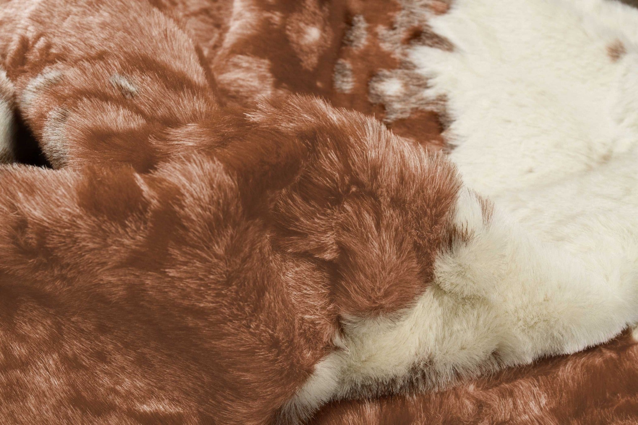 4' X 5' Brown And Ivory Faux Cowhide Animal Print Area Rug