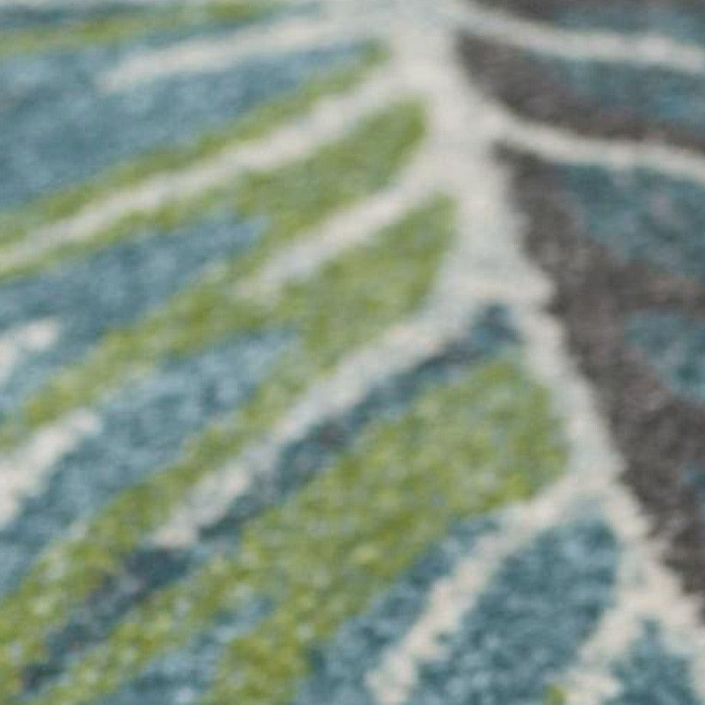 7' X 10' Beige Teal And Green Tropical Botanical Area Rug