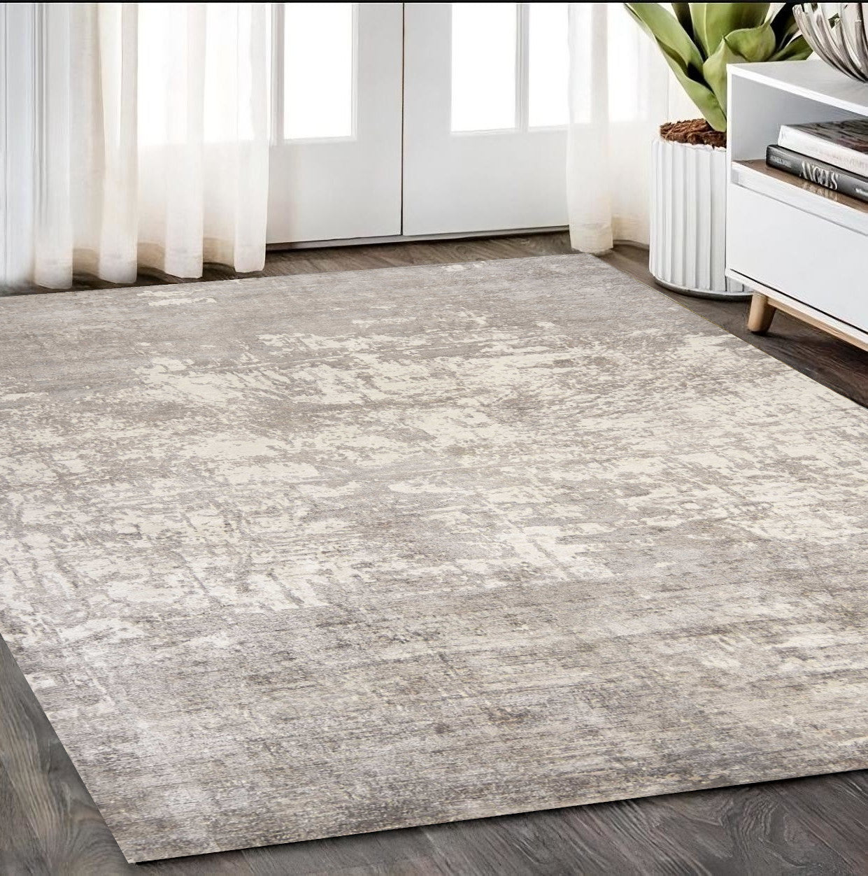 5' X 7' Beige And Ivory Abstract Hand Loomed Area Rug