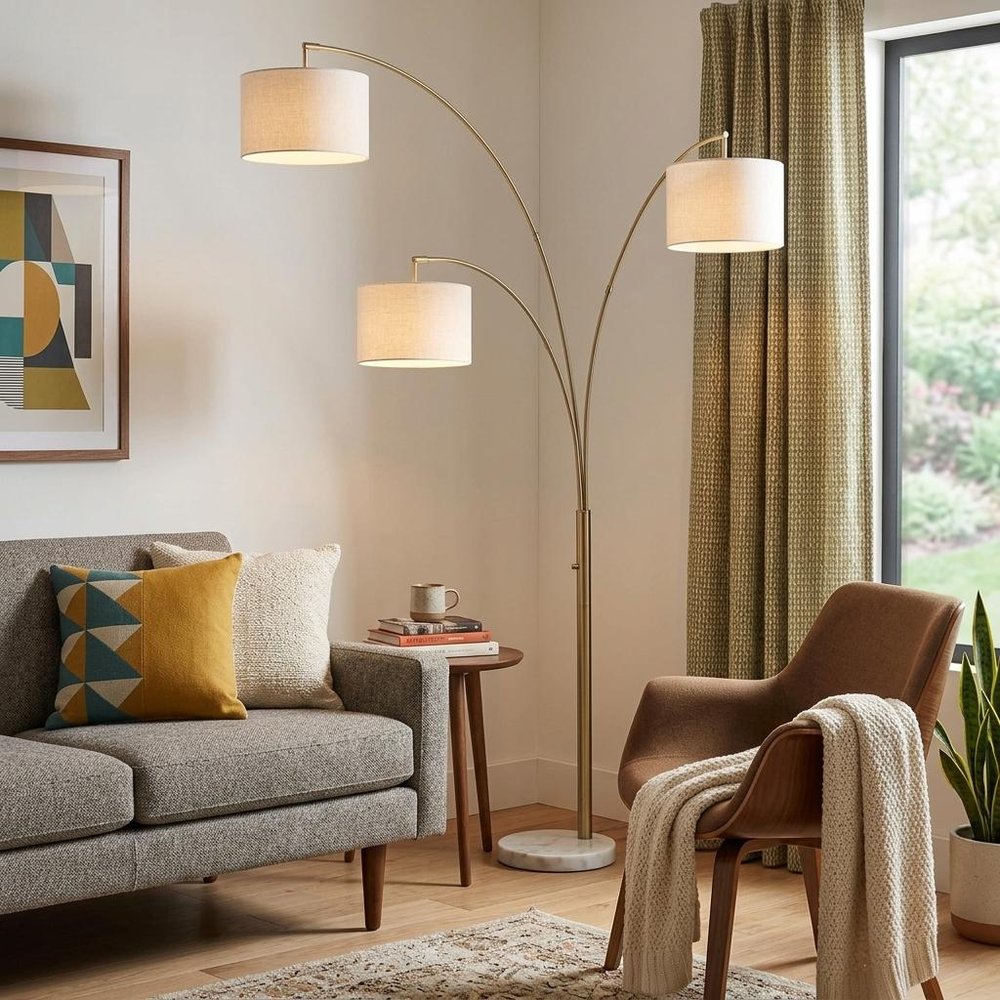 74" Brass Three Light Arc Floor Lamp With Off White Fabric Drum Shade