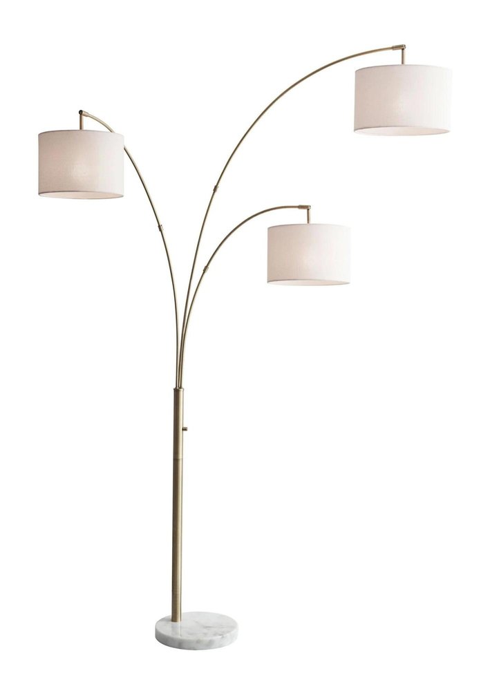 74" Brass Three Light Arc Floor Lamp With Off White Fabric Drum Shade