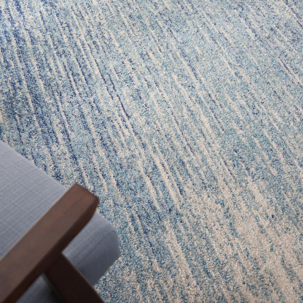 5' X 7' Blue And Ivory Abstract Area Rug