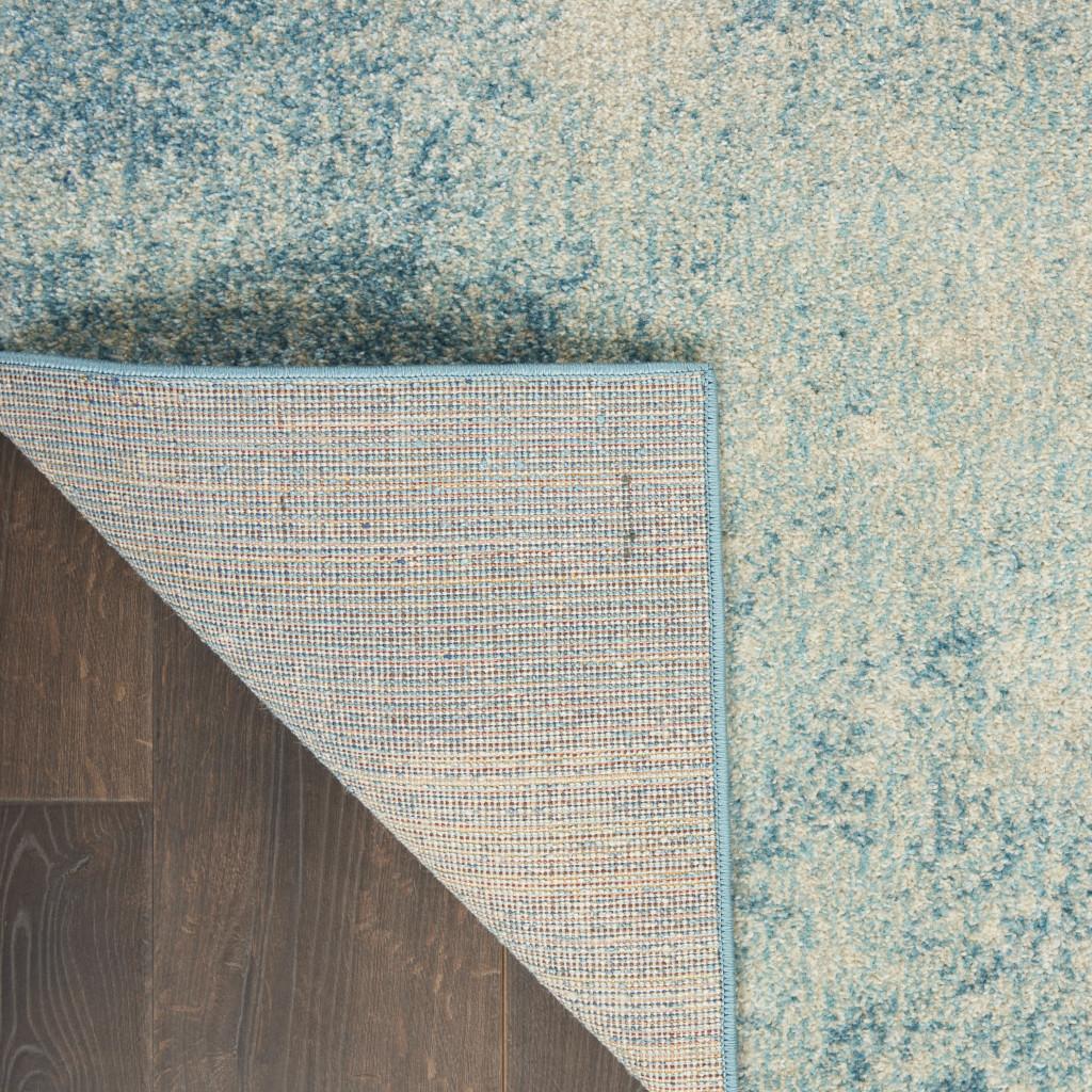 4' X 6' Blue And Ivory Abstract Area Rug