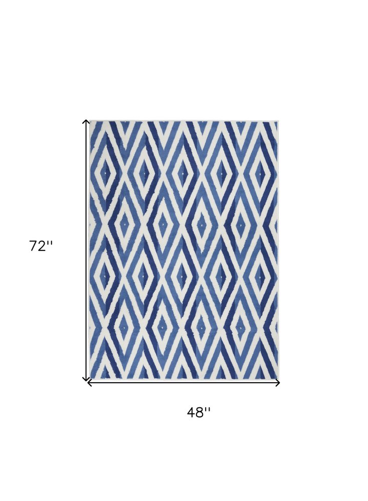 4' X 6' Ivory And Blue Geometric Area Rug