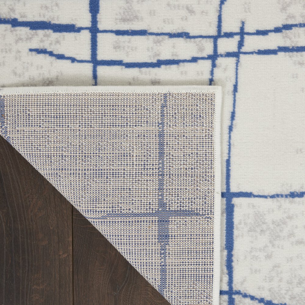 4' X 6' Ivory And Blue Geometric Distressed Area Rug