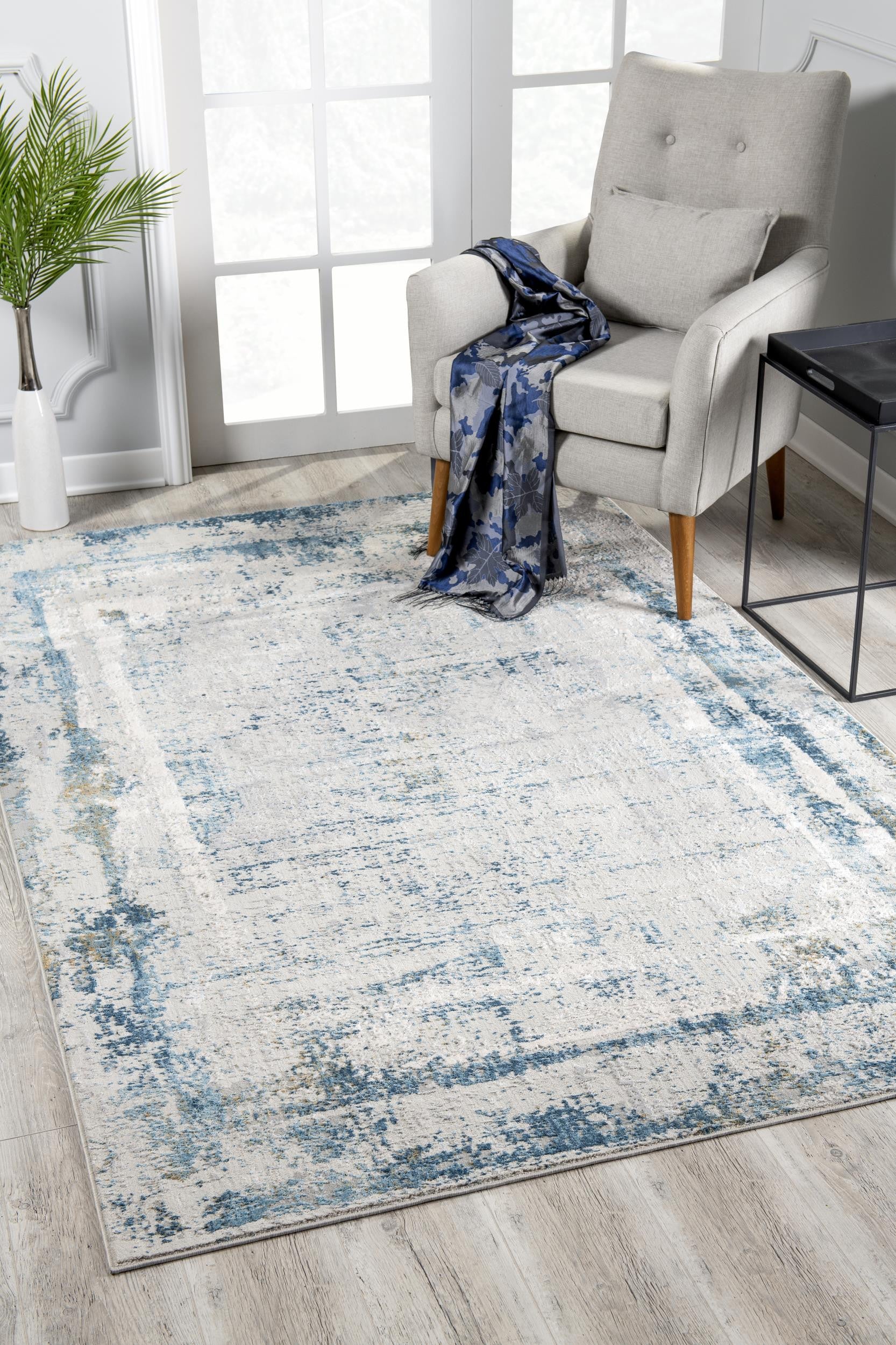 4' X 6' Blue and Ivory Abstract Power Loom Area Rug