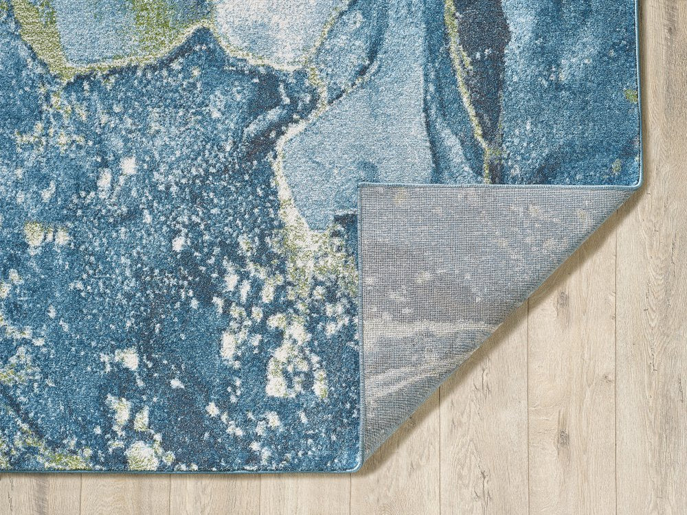 7' X 10' Teal Blue Green And Ivory Abstract Area Rug
