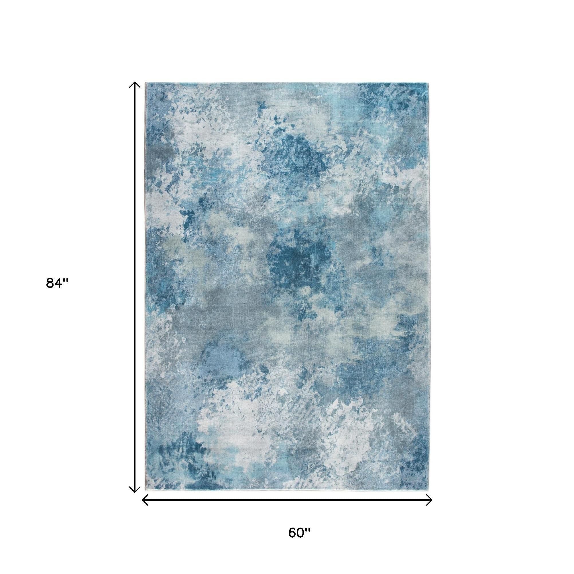 5' X 8' Blue And Ivory Abstract Area Rug
