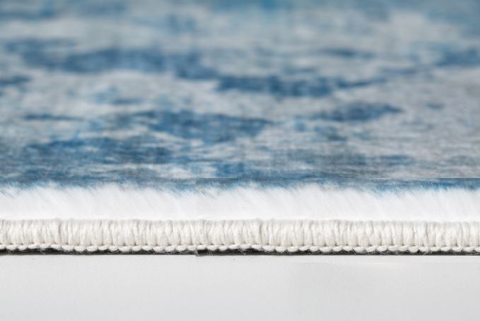 5' X 8' Blue And Ivory Abstract Area Rug
