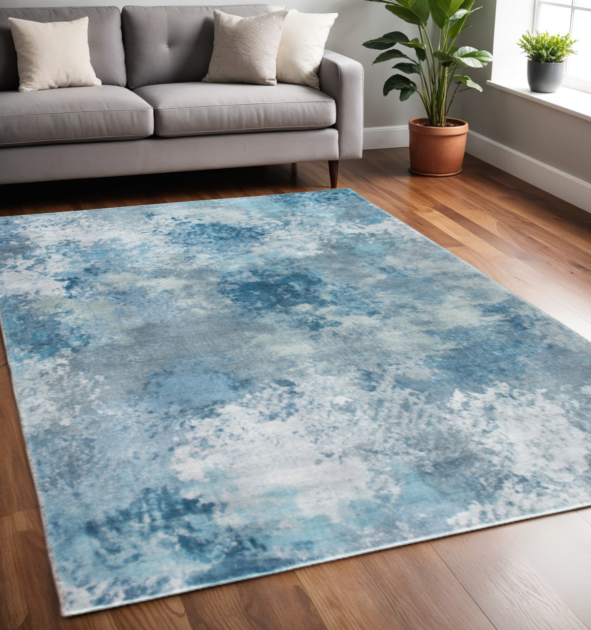 5' X 8' Blue And Ivory Abstract Area Rug
