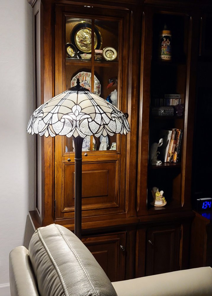 62" Dark Brown Two Light Torchiere Floor Lamp With White Fleur de Lis Glass Dome Shade