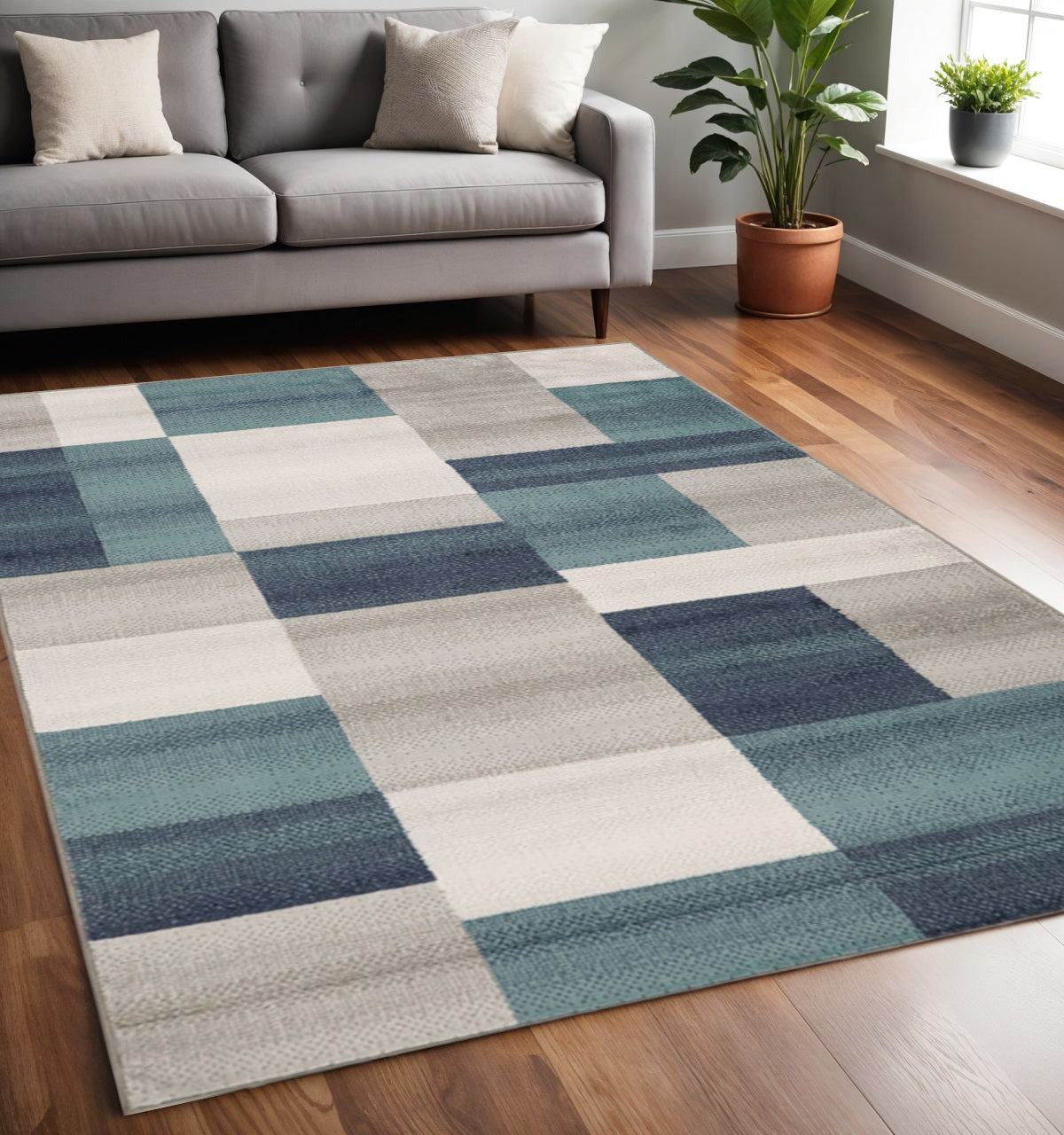 5' X 8' Teal And Ivory Patchwork Area Rug