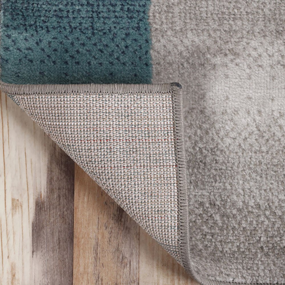 5' X 8' Teal And Ivory Patchwork Area Rug