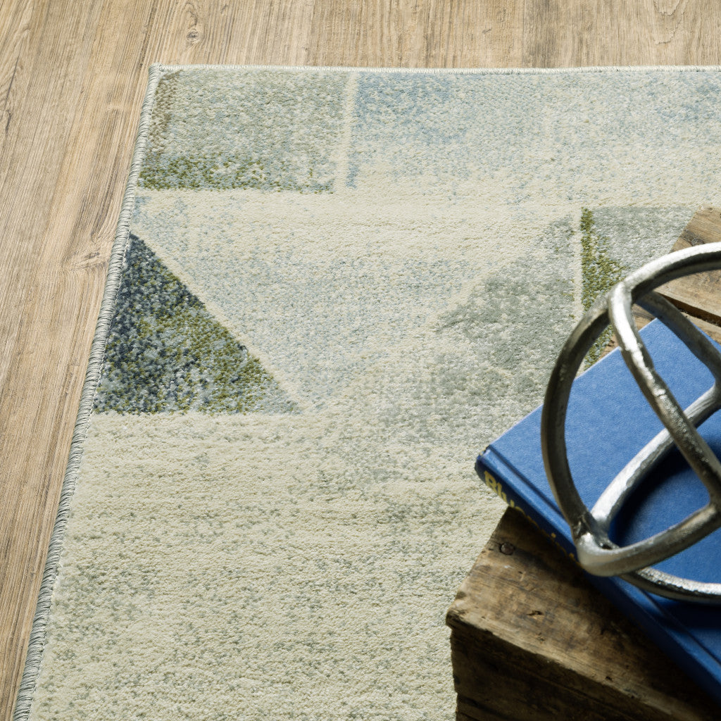 7' X 9' Gray And Ivory Geometric Area Rug