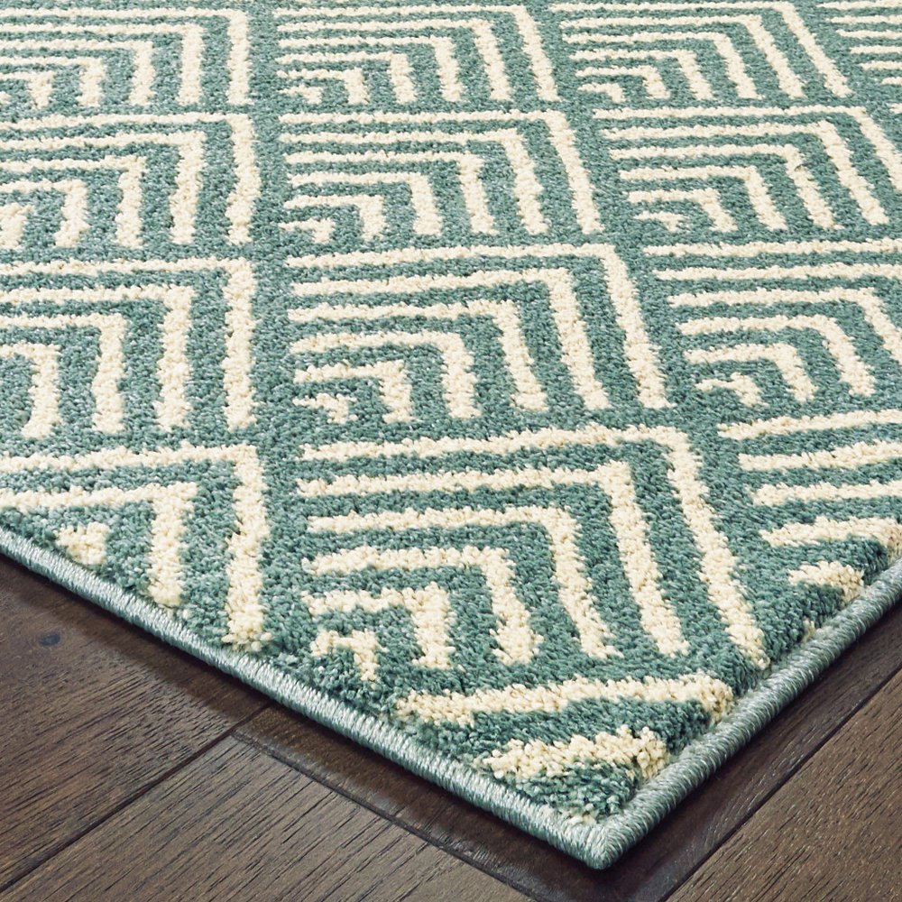 7' X 9' Blue And Ivory Geometric Shag Area Rug