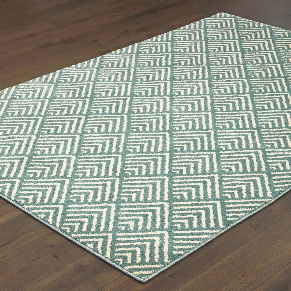 7' X 9' Blue And Ivory Geometric Shag Area Rug