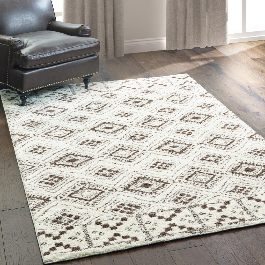 6' X 9' Ivory And Brown Geometric Shag Power Loom Stain Resistant Area Rug