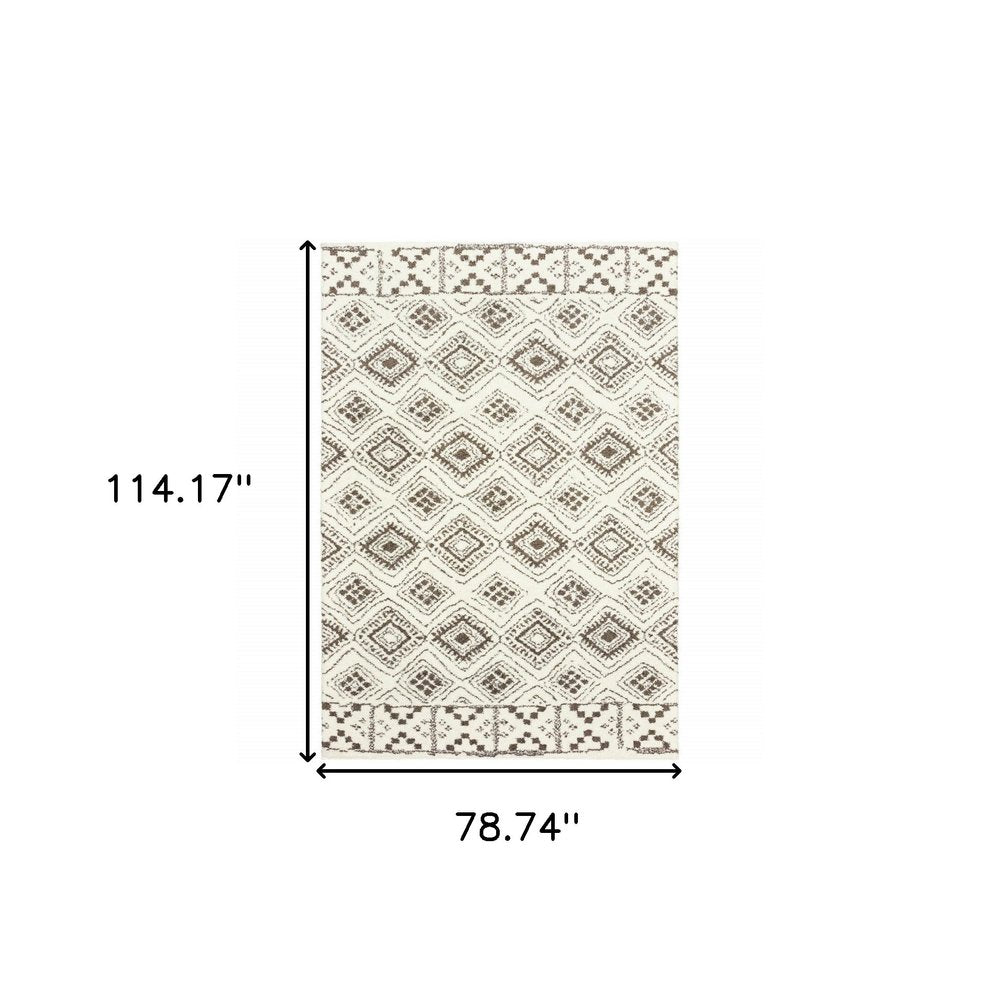 7' X 10' Ivory And Brown Geometric Shag Area Rug