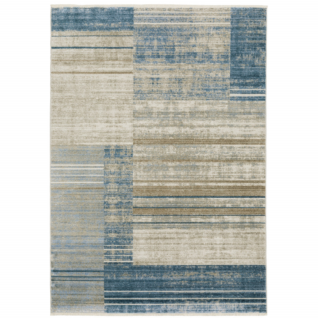 6' X 9' Blue Dark Blue Teal Grey Ivory Beige And Tan Geometric Power Loom Stain Resistant Area Rug With Fringe