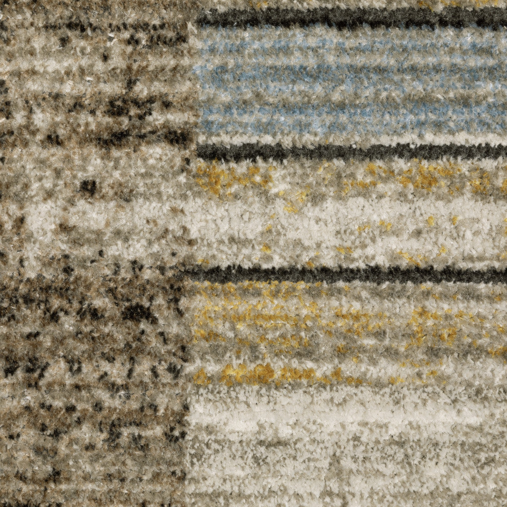 5' X 8' Beige Charcoal Brown Grey Tan Gold And Blue Geometric Power Loom Stain Resistant Area Rug With Fringe