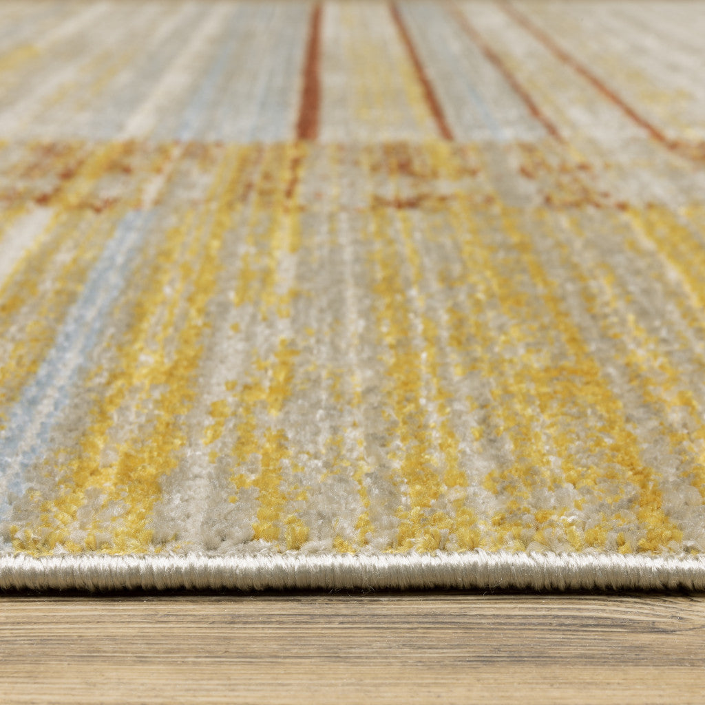 4' X 6' Rust Gold Blue Grey Ivory And Tan Geometric Power Loom Stain Resistant Area Rug With Fringe