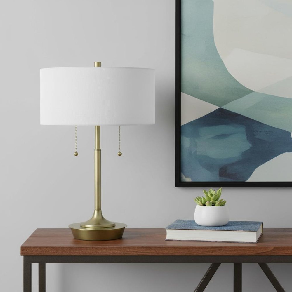 20" Antiqued Brass Metal Two Light Table Lamp With White Drum Shade