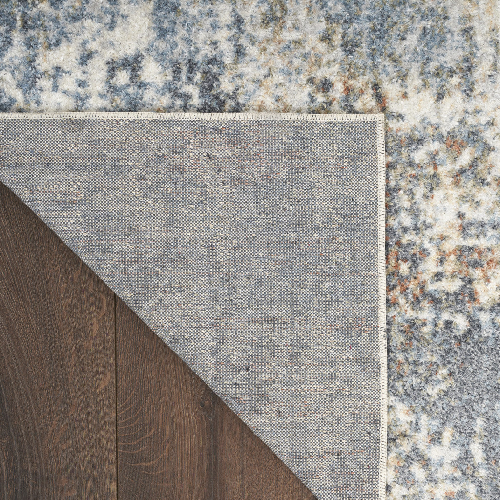 4' X 6' Blue and Ivory Abstract Power Loom Washable Area Rug