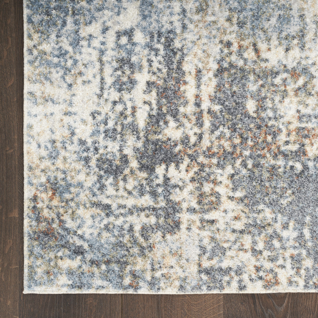 4' X 6' Blue and Ivory Abstract Power Loom Washable Area Rug