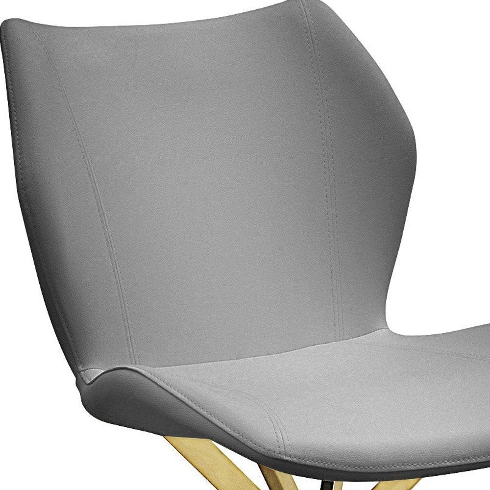 Set of Four Gray and Gold Faux Leather Dining Side Chairs