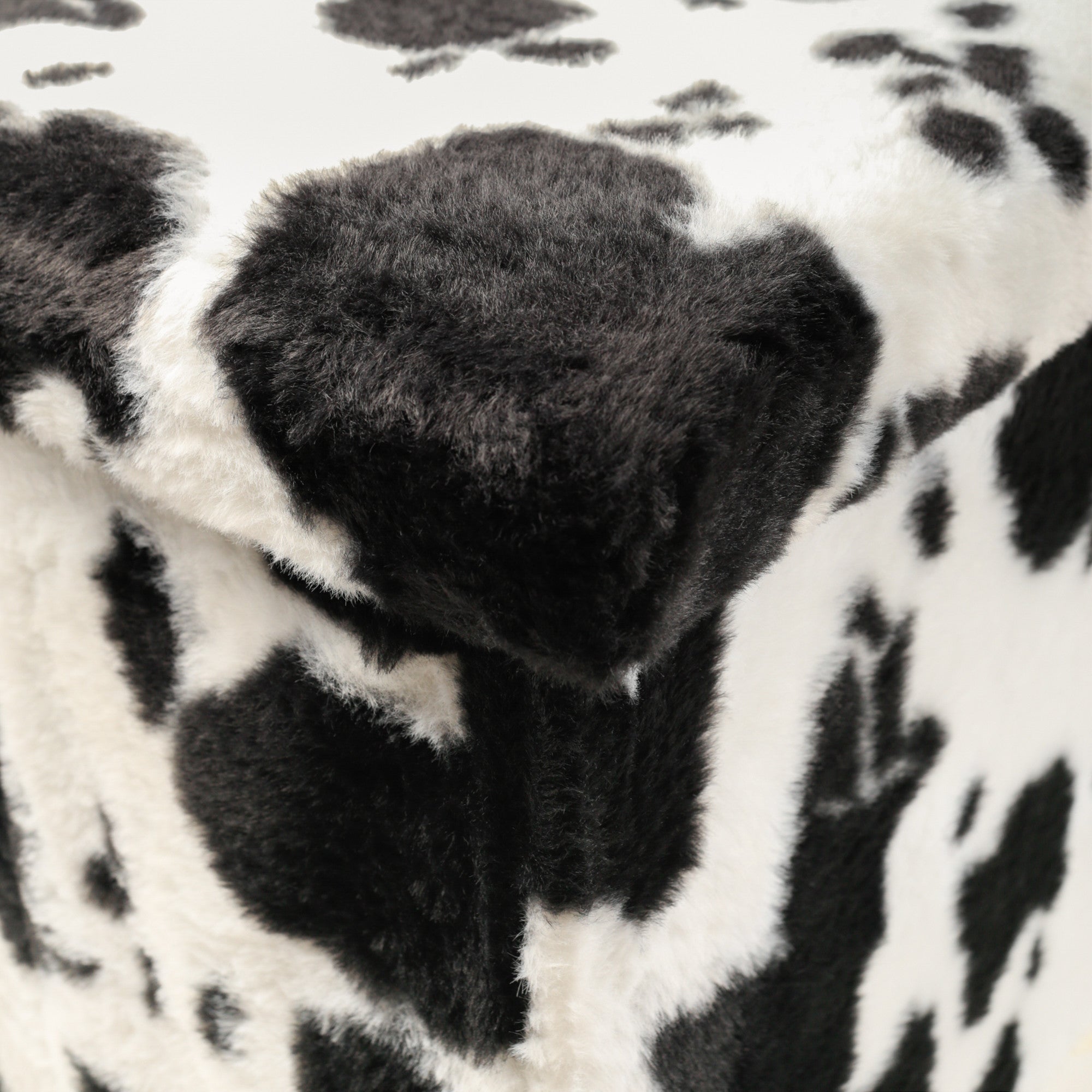 30" Black And White Faux Fur Cow Print Ottoman