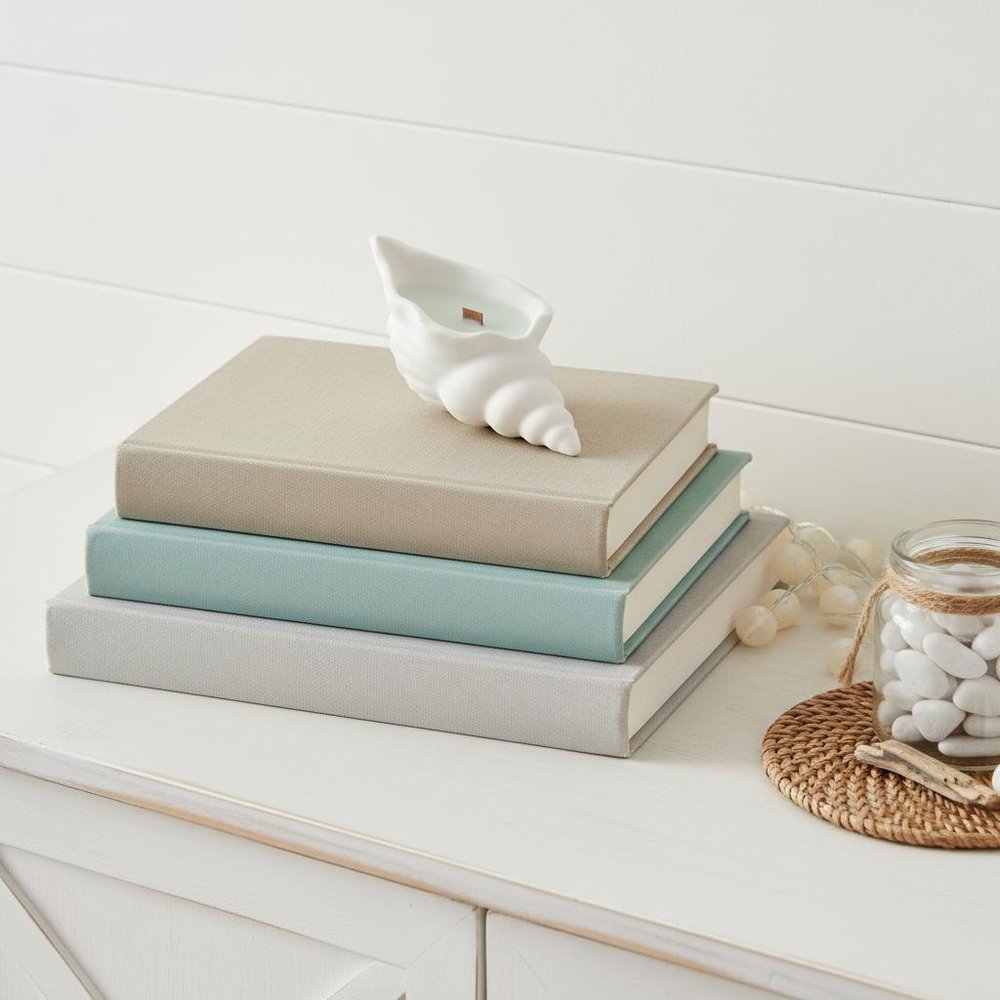 6" Light Blue Sea Salt And Orchid Scented Soy Wax Candle In White Resin Novelty Holder