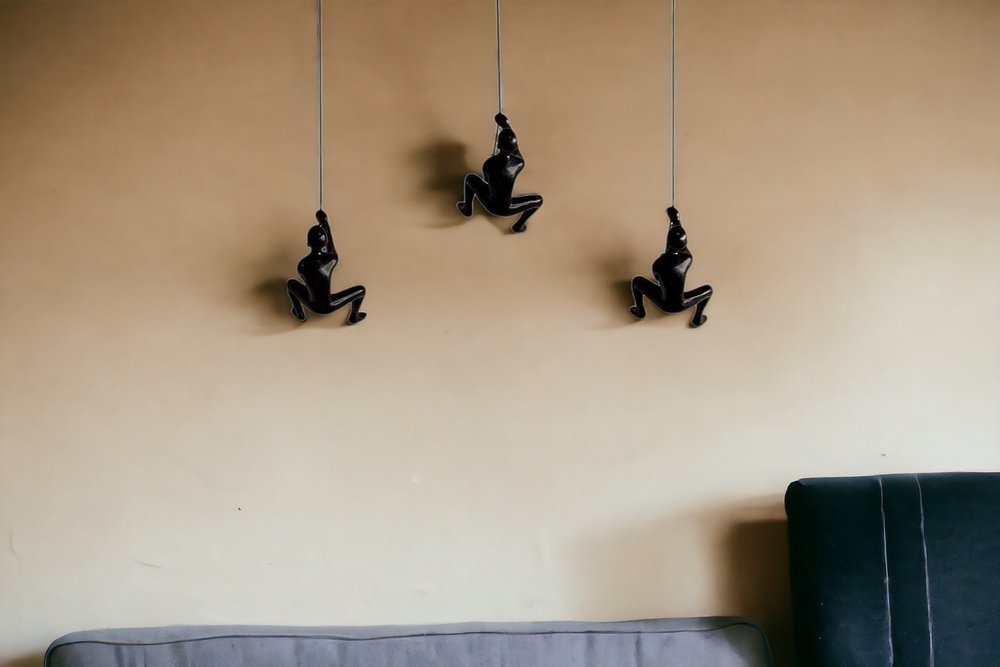 Set of Three Black Resin Climbing Man Hanging Dimensional Sculpture