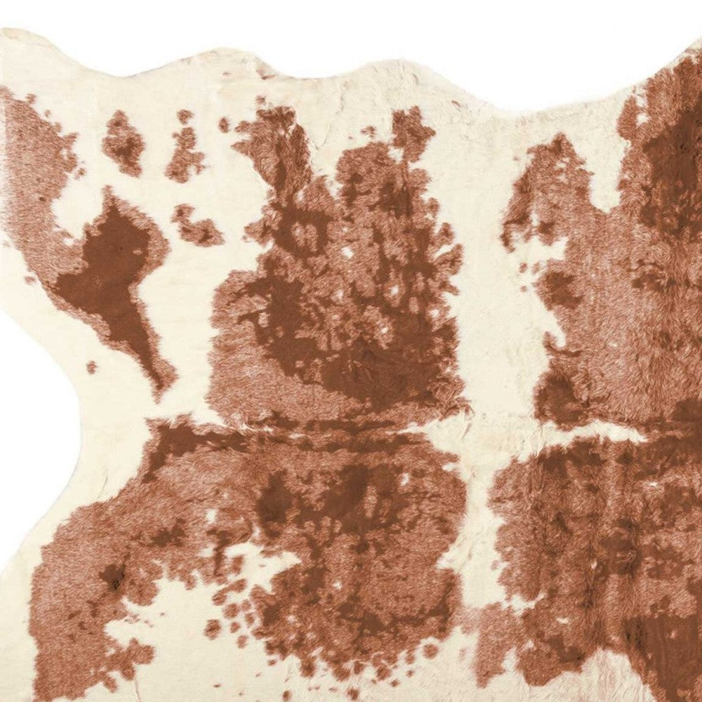 4' X 5' Brown And Ivory Faux Cowhide Animal Print Area Rug