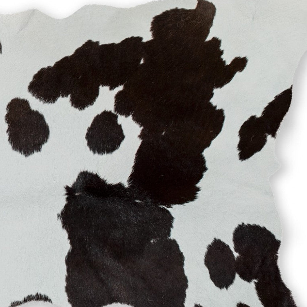 2' X 3' Brown And White Cowhide Abstract Hand Woven Area Rug