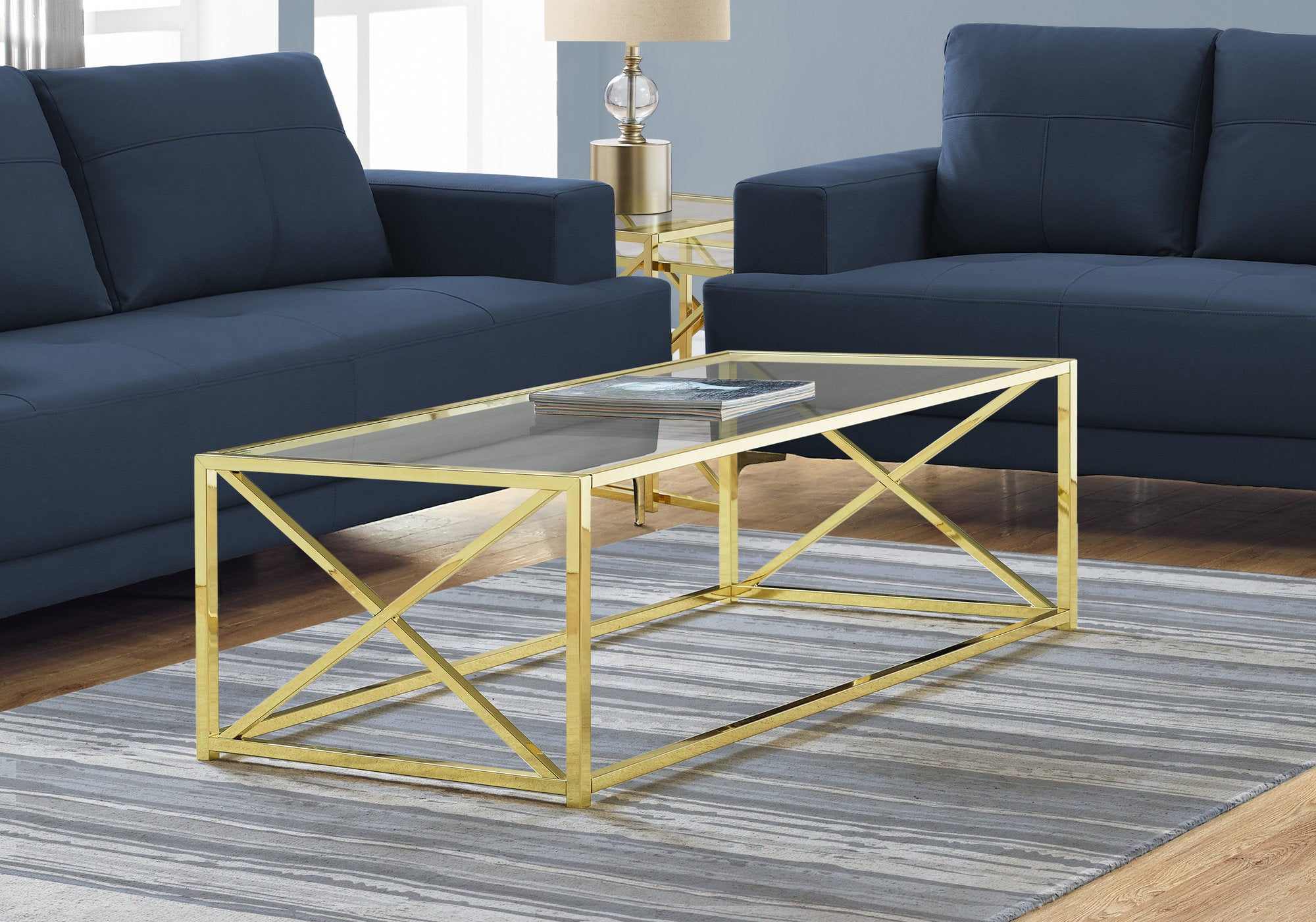 44" Clear And Gold Glass And Iron Coffee Table