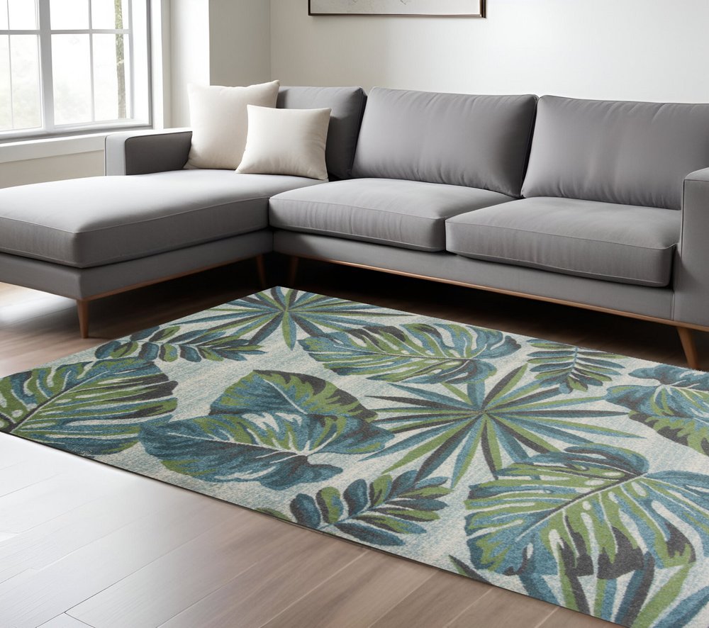 7' X 10' Beige Teal And Green Tropical Botanical Area Rug