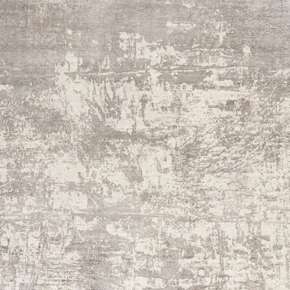 5' X 7' Beige And Ivory Abstract Hand Loomed Area Rug