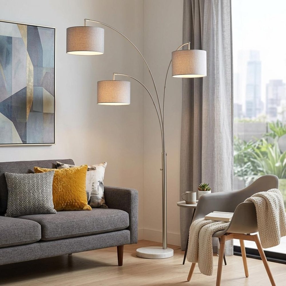 74" Brass Three Light Arc Floor Lamp With Off White Fabric Drum Shade