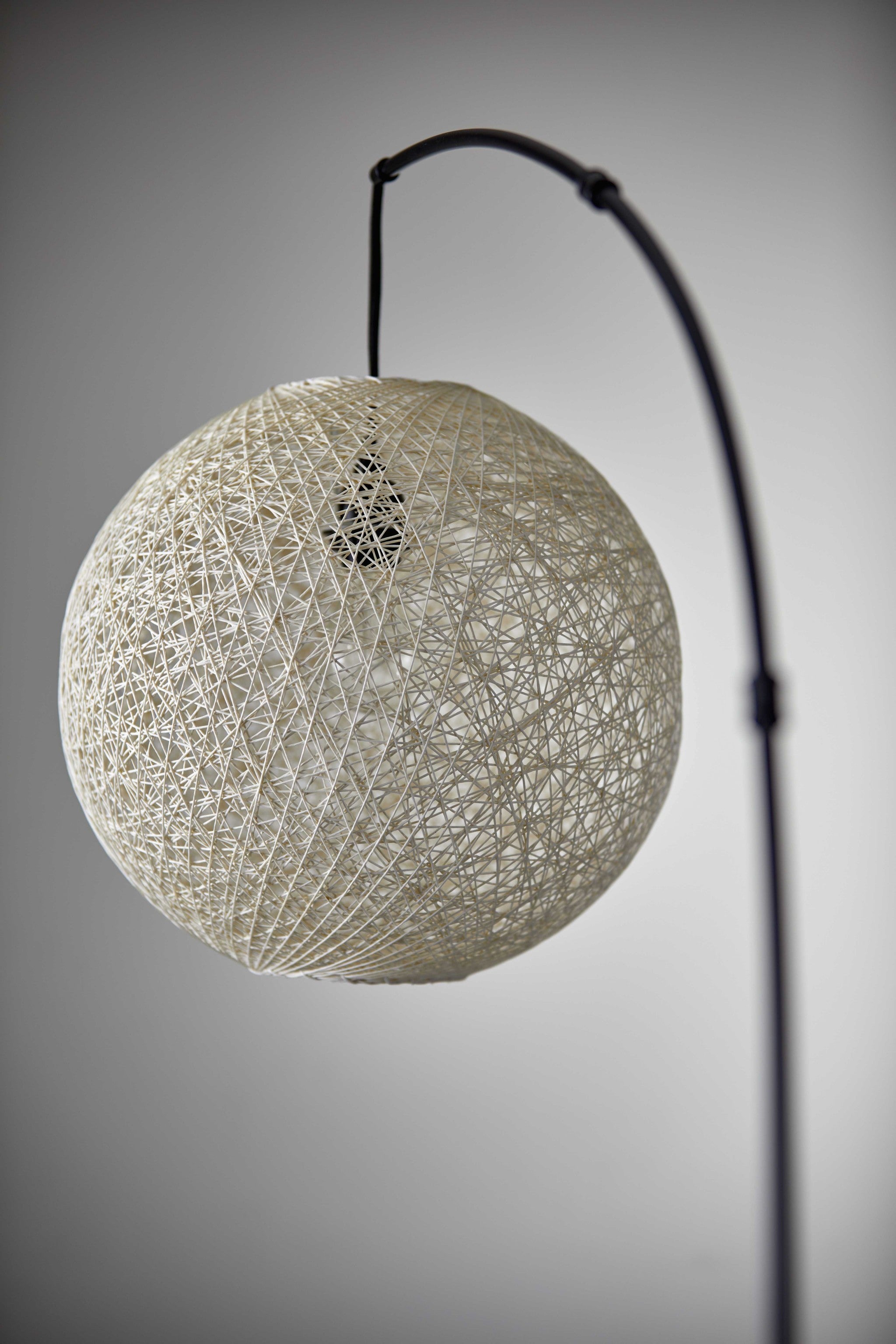 Floor Lamp With Bronze Metal Arc And Groovy Rattan String Ball Shade