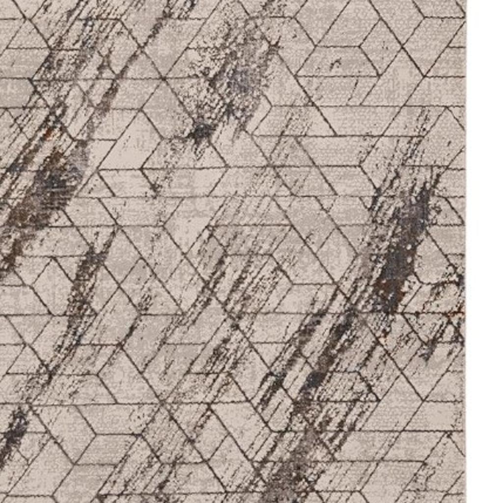 7' X 10' Ivory And Brown Geometric Area Rug