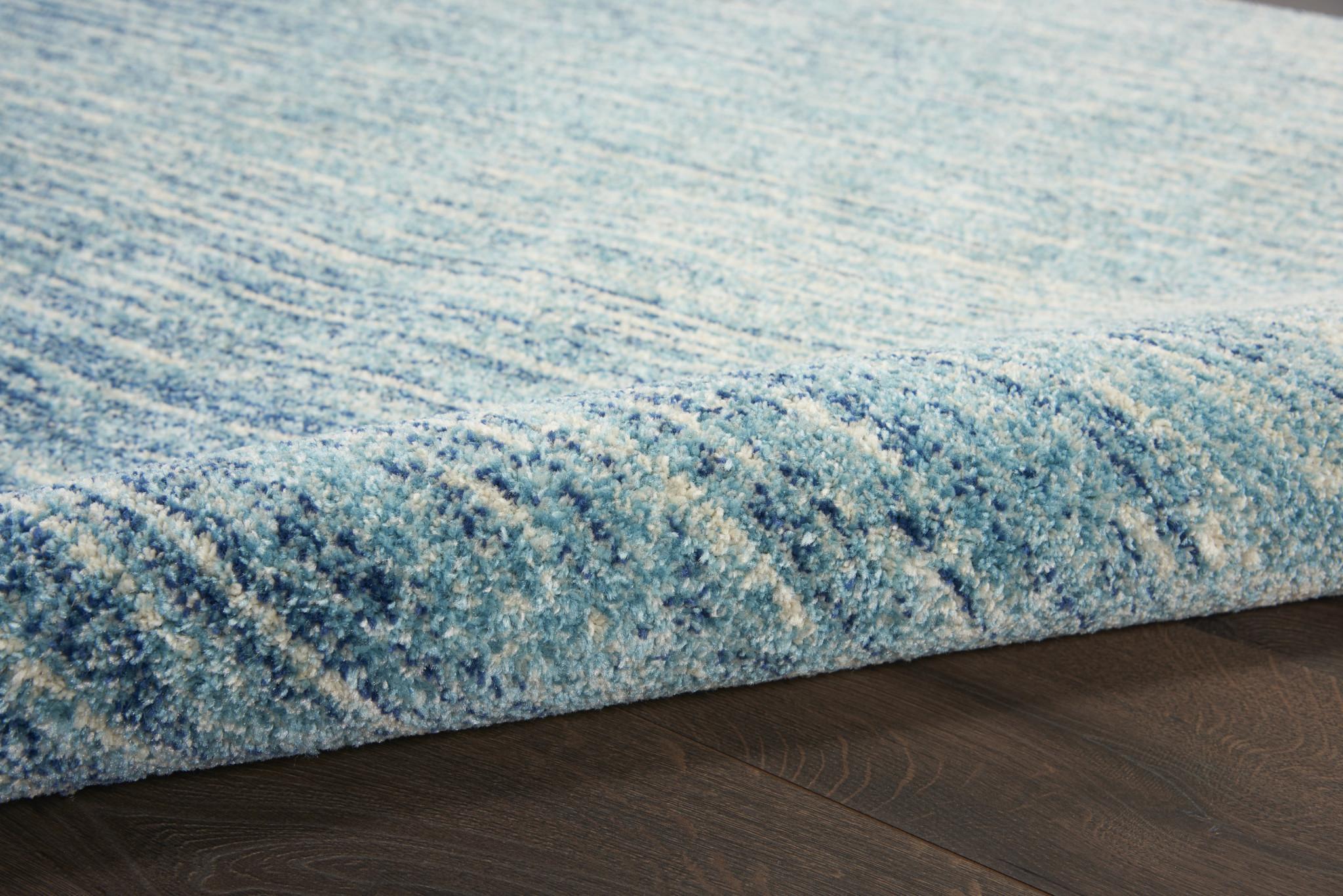 5' X 7' Blue And Ivory Abstract Area Rug