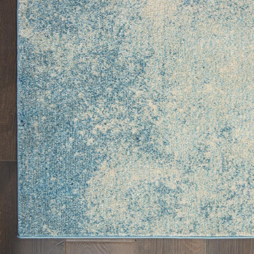 7' X 10' Blue And Ivory Abstract Area Rug
