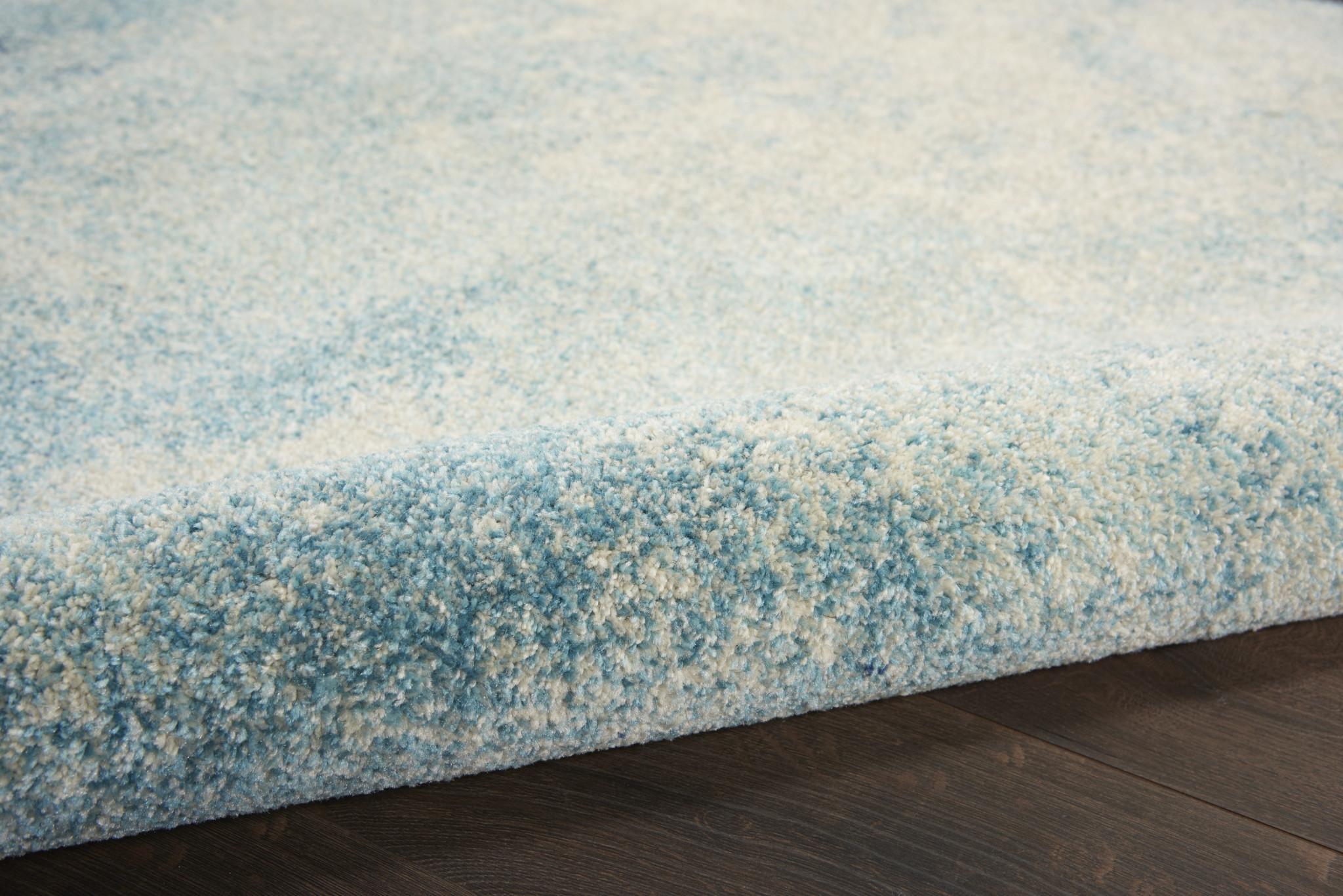 7' X 10' Blue And Ivory Abstract Area Rug