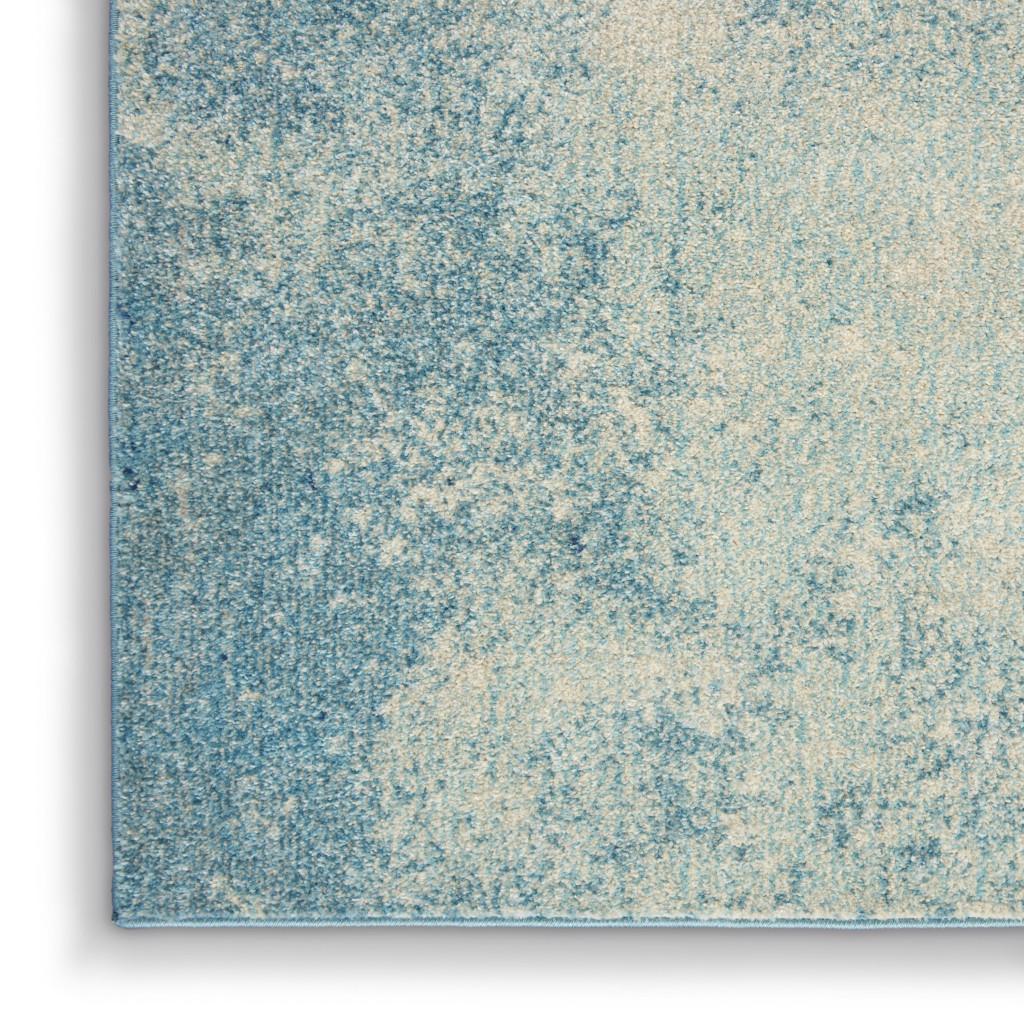 7' X 10' Blue And Ivory Abstract Area Rug