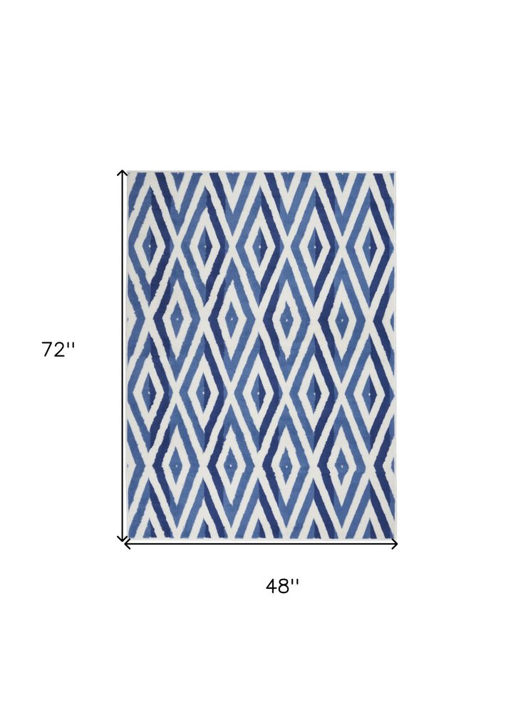 4' X 6' Ivory And Blue Geometric Area Rug