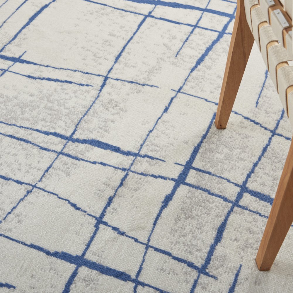 4' X 6' Ivory And Blue Geometric Distressed Area Rug