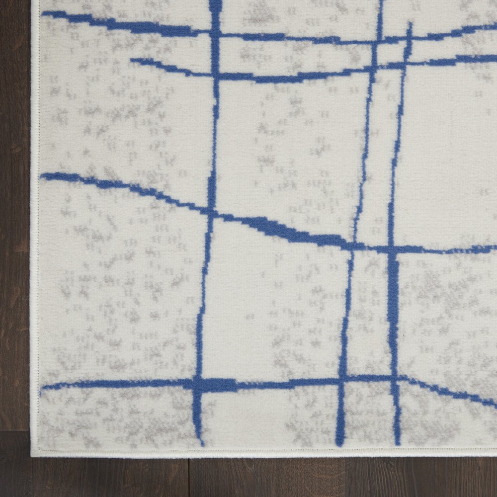4' X 6' Ivory And Blue Geometric Distressed Area Rug
