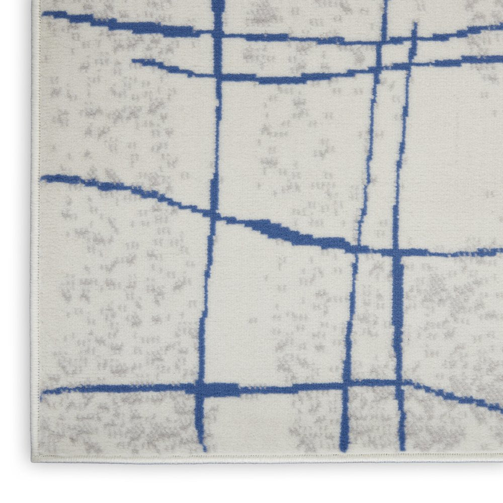 4' X 6' Ivory And Blue Geometric Distressed Area Rug
