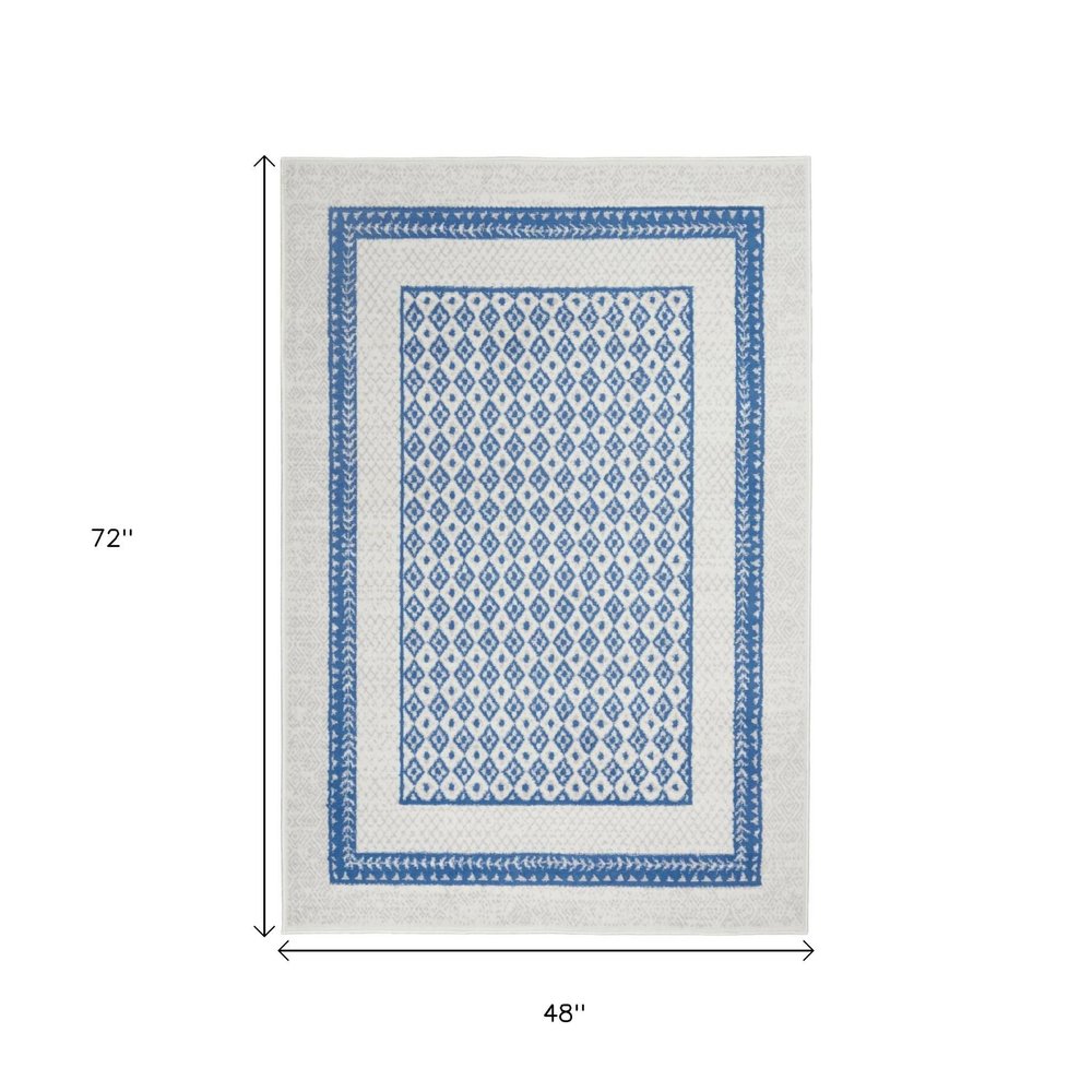 4' X 6' Ivory And Blue Geometric Area Rug