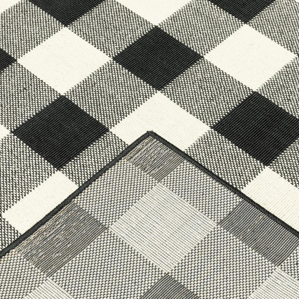 2' X 4' Black And Ivory Indoor Outdoor Area Rug